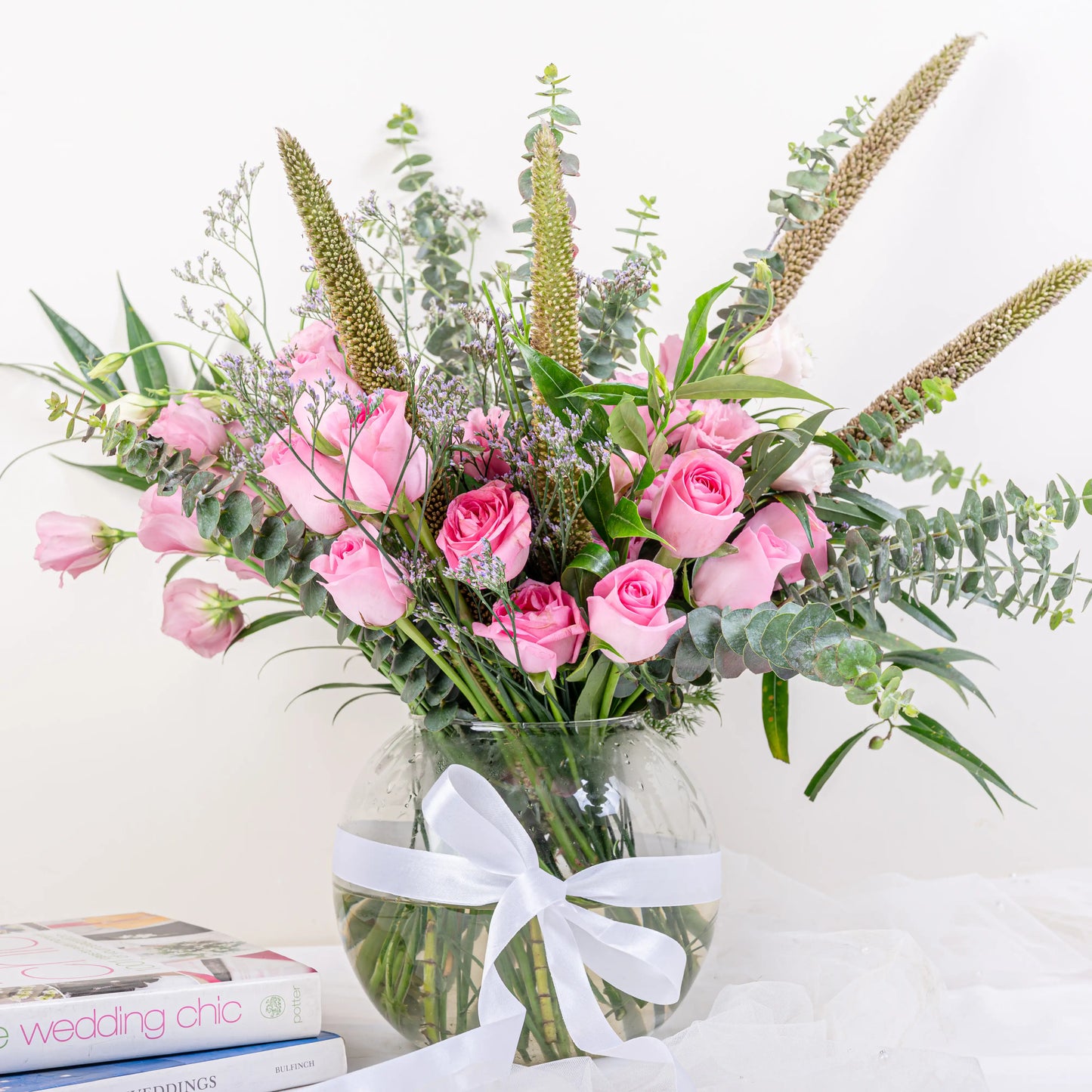 Blush Garden pink rose and eucalyptus fishbowl arrangement with lisianthus and veronica in glass vase by House of Mograa