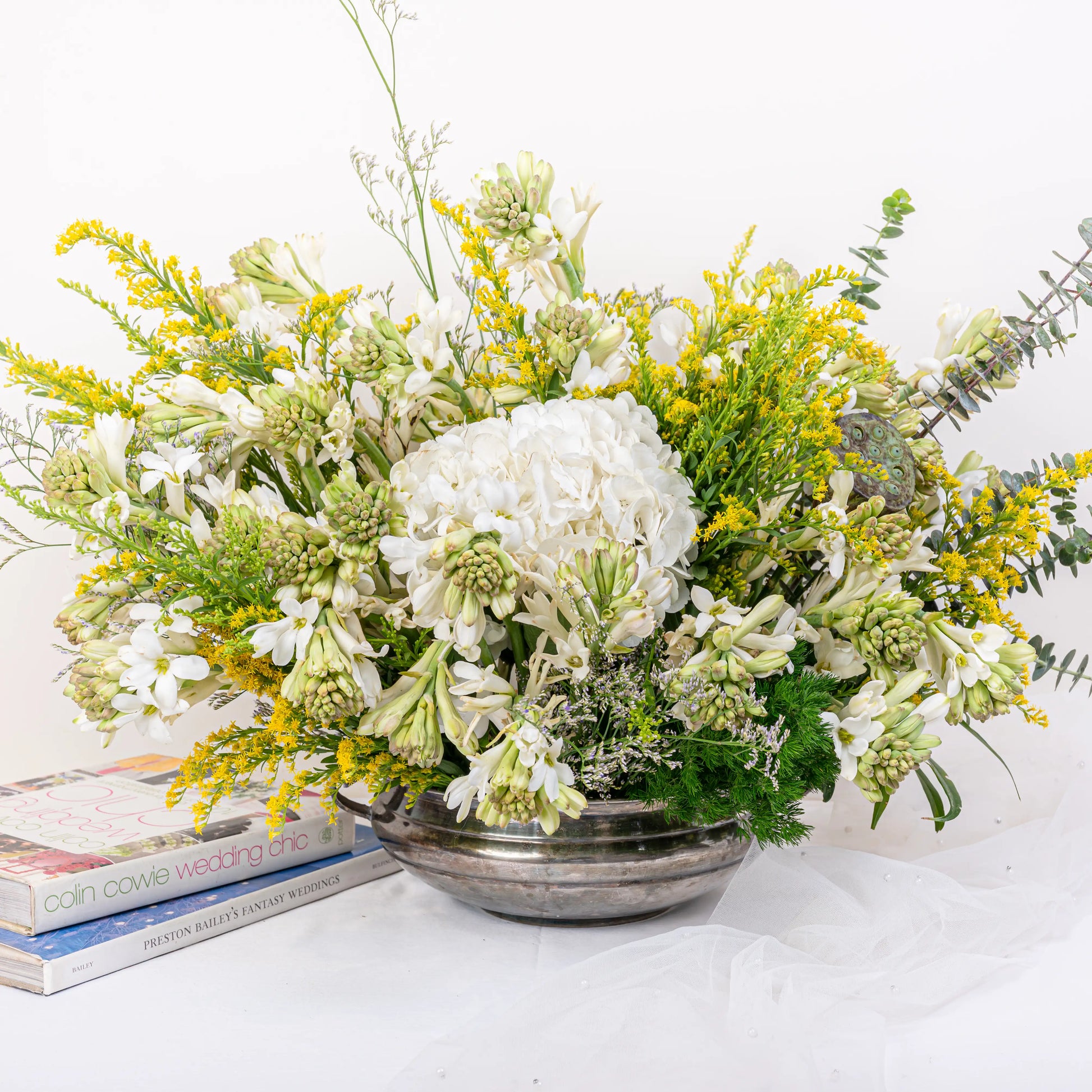 Alabaster premium white floral arrangement with white roses and lilies in elegant glass vase by House of Mograa