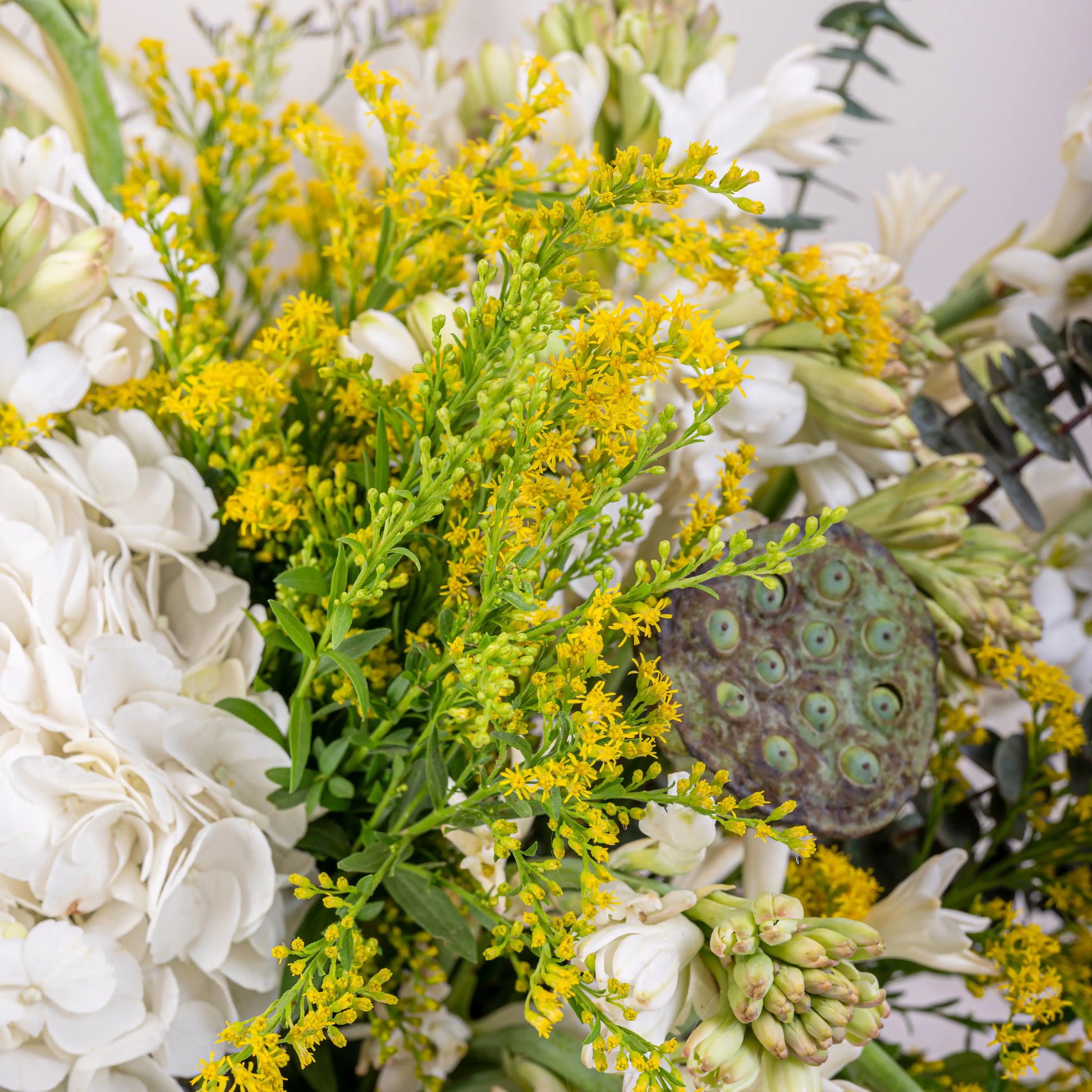 Alabaster premium white floral arrangement with white roses and lilies in elegant glass vase by House of Mograa