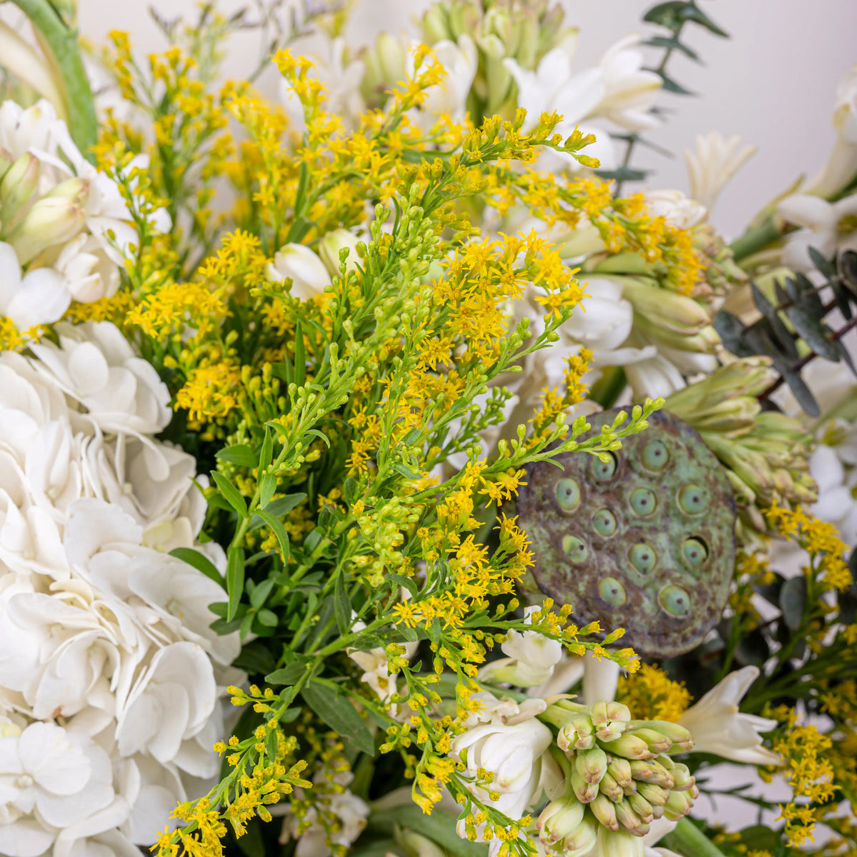 Alabaster premium white floral arrangement with white roses and lilies in elegant glass vase by House of Mograa