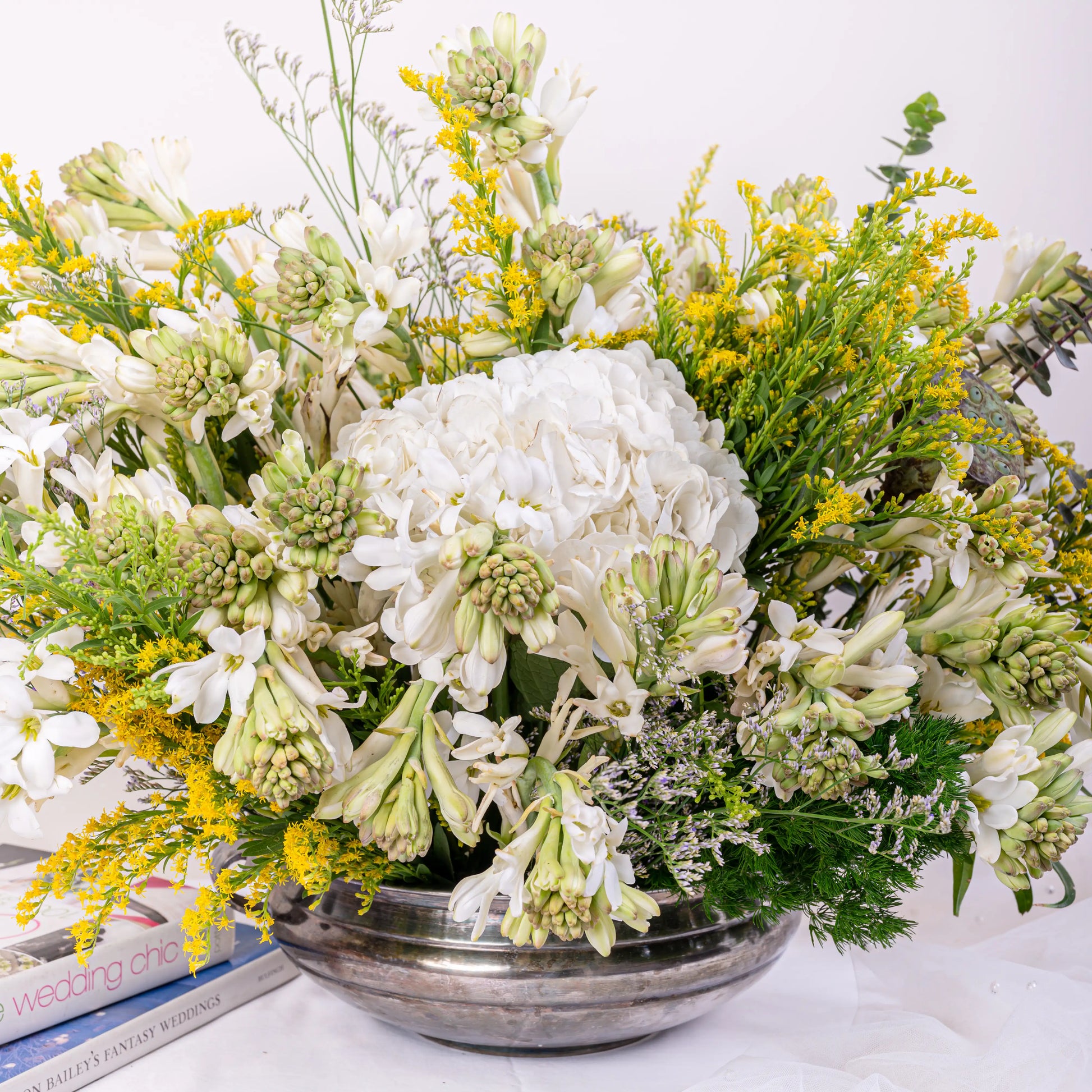 Alabaster premium white floral arrangement with white roses and lilies in elegant glass vase by House of Mograa
