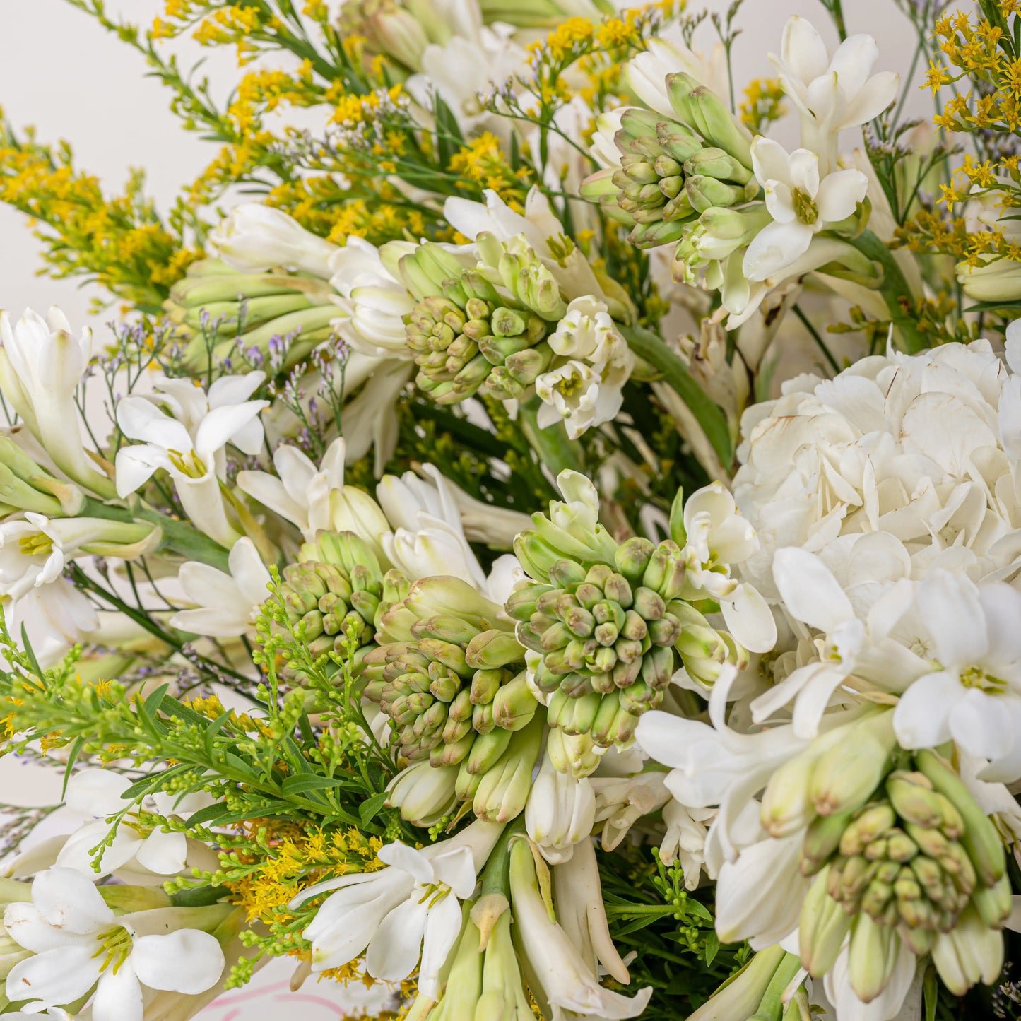 Alabaster premium white floral arrangement with white roses and lilies in elegant glass vase by House of Mograa