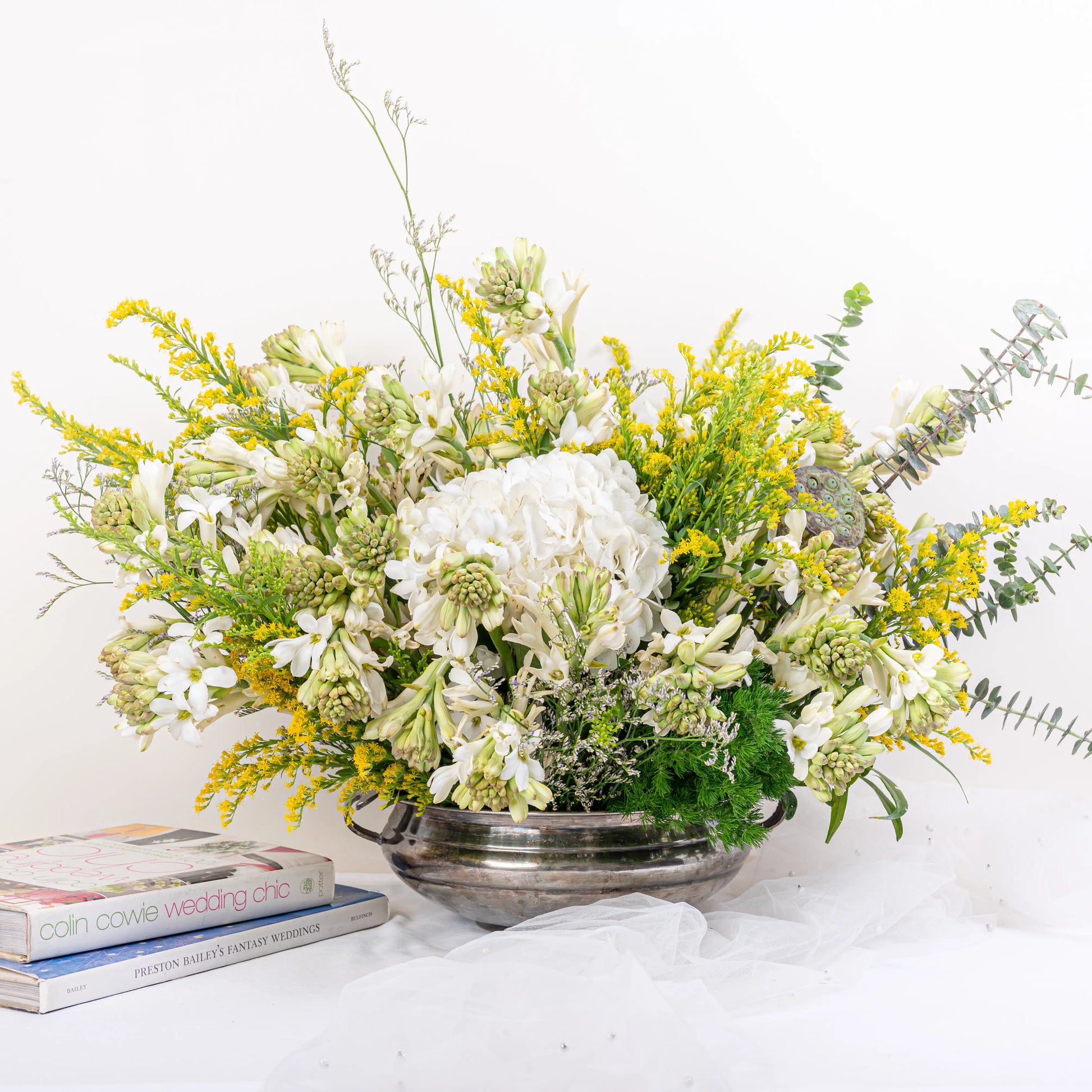 Alabaster premium white floral arrangement with white roses and lilies in elegant glass vase by House of Mograa
