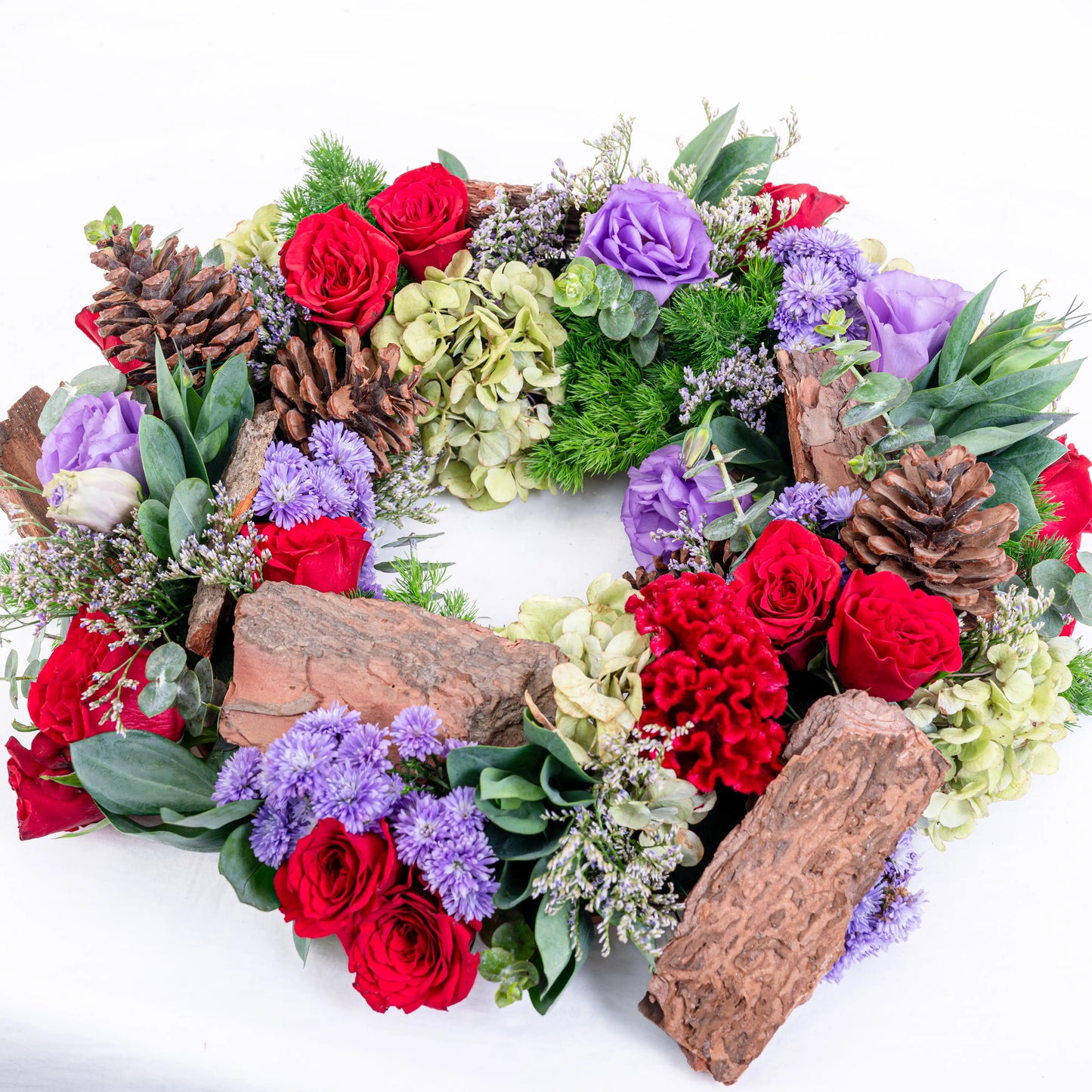 Amethyst Ember round red and purple floral arrangement with red roses and purple blooms in premium box by House of Mograa
