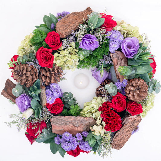 Amethyst Ember round red and purple floral arrangement with red roses and purple blooms in premium box by House of Mograa