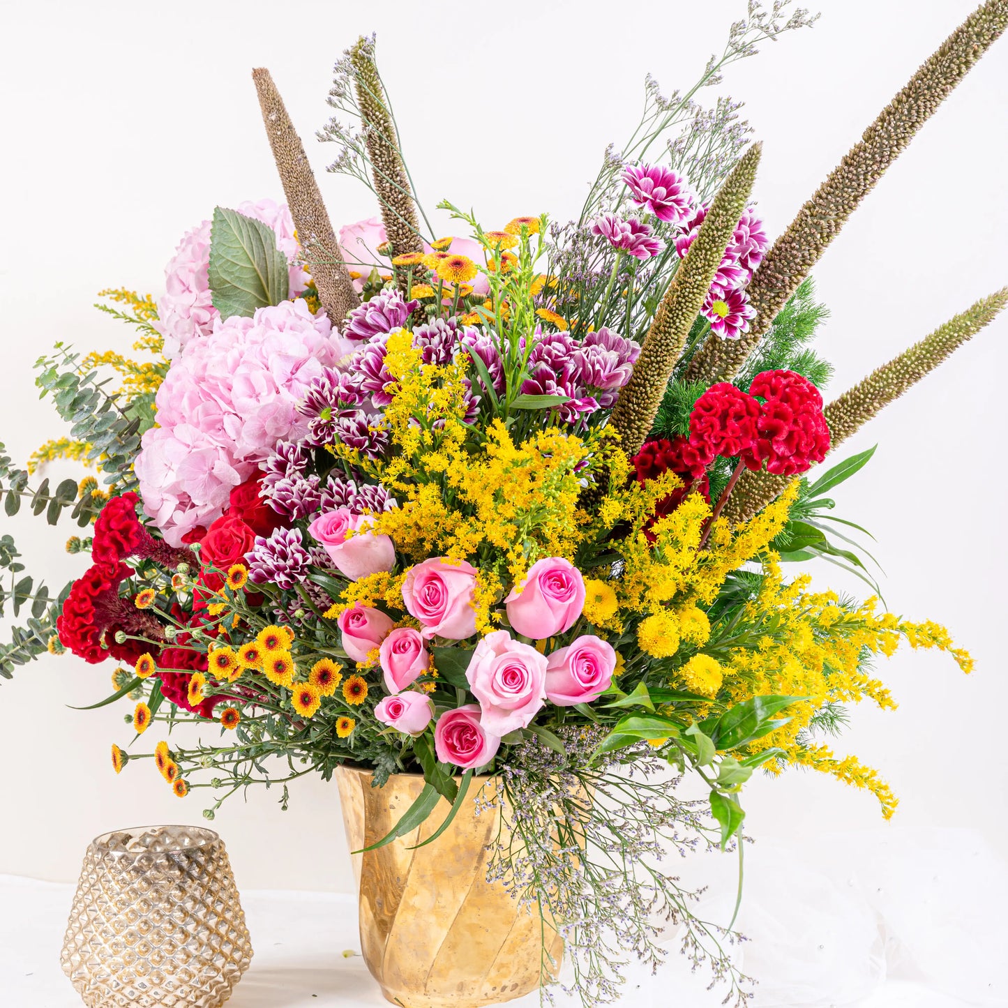 Blush and Flame red and pink floral arrangement with red roses and pink blooms in premium container by House of Mograa