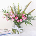 Blush Garden pink rose and eucalyptus fishbowl arrangement with lisianthus and veronica in glass vase by House of Mograa