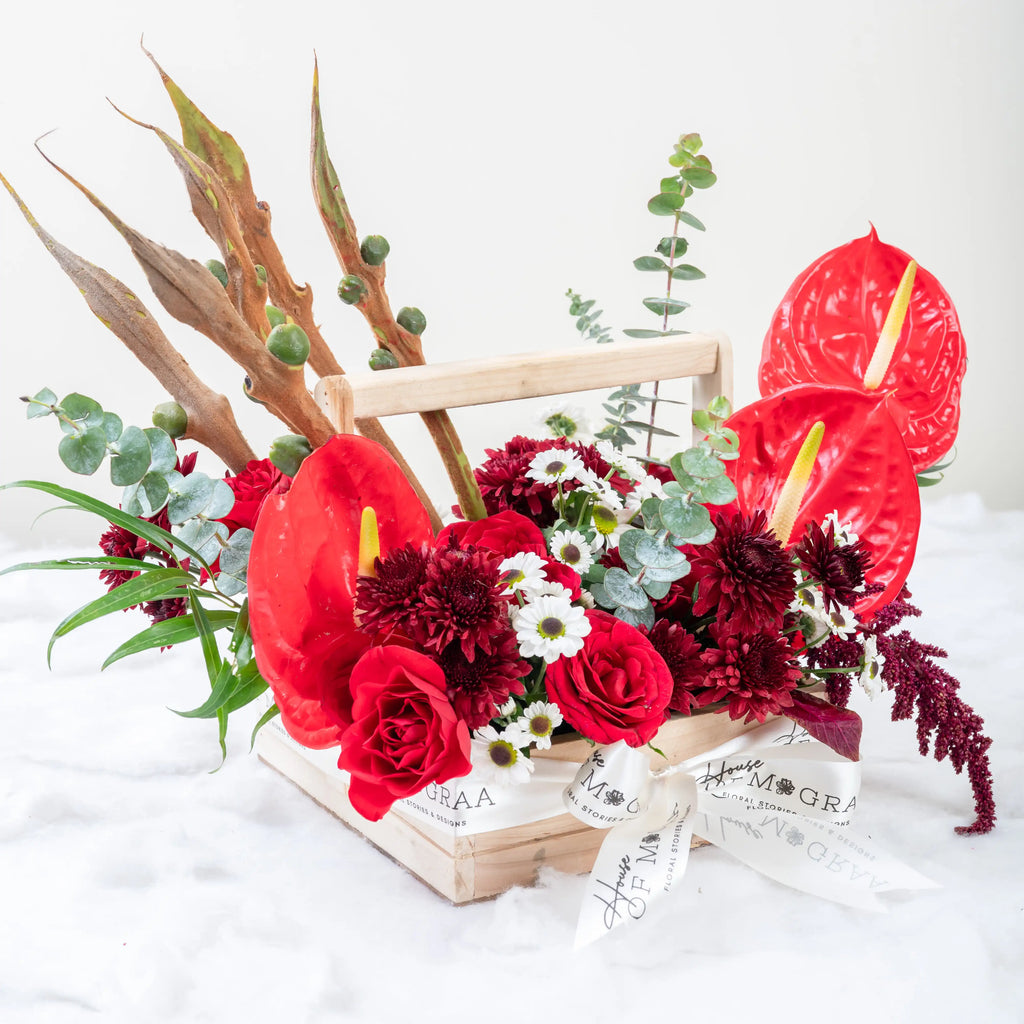 Crimson Fusion red rose and red anthurium mixed arrangement with greenery by House of Mograa