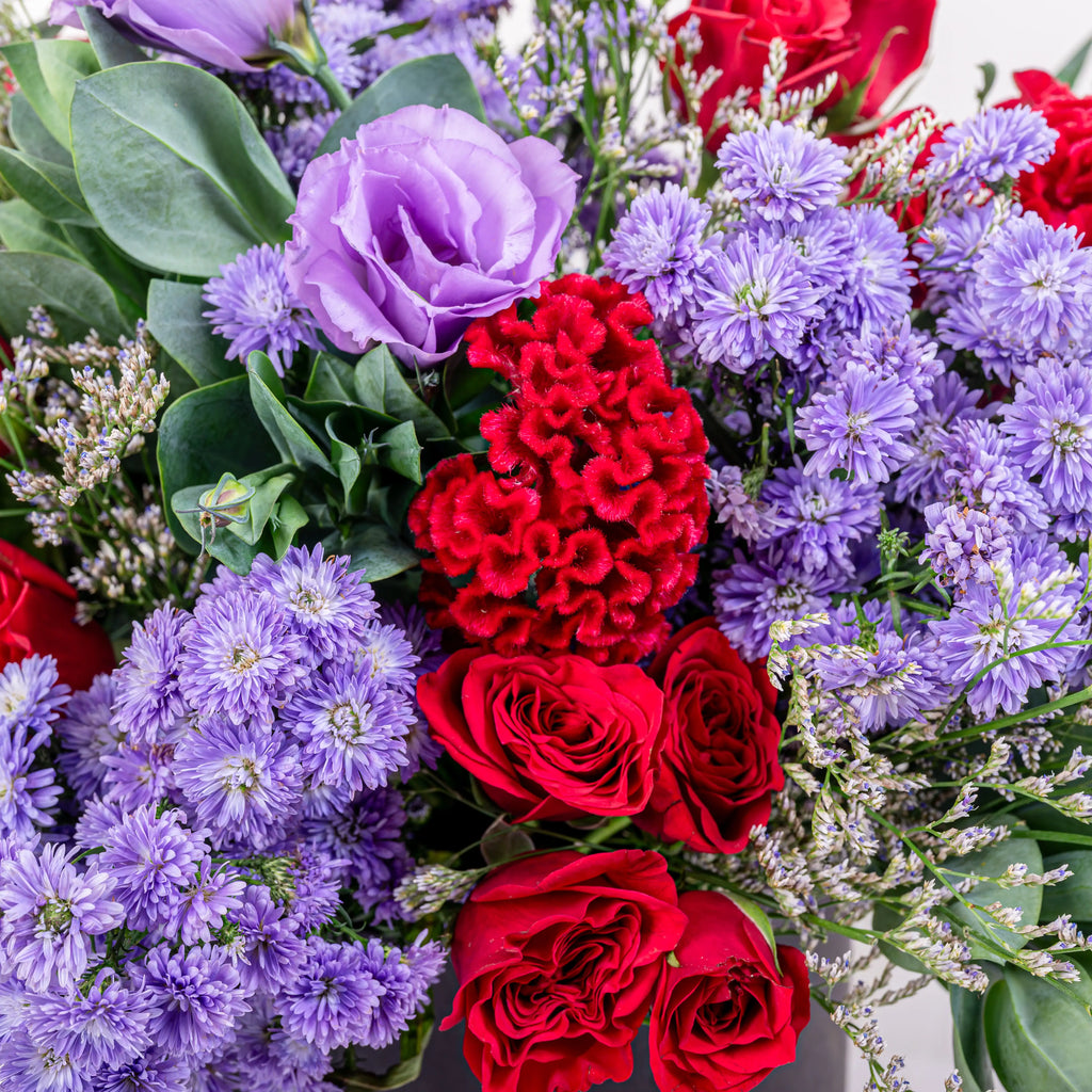 La Rouge classic red rose arrangement with premium red roses in elegant glass vase by House of Mograa